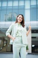 Portrait of young Asian businesswoman outside the office photo