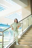 Portrait of young Asian businesswoman outside the office photo