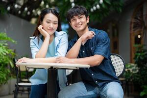 Photo of young Asian couple hang out together