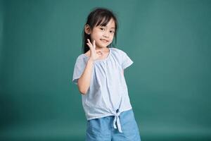 Photo of Asian baby girl on background