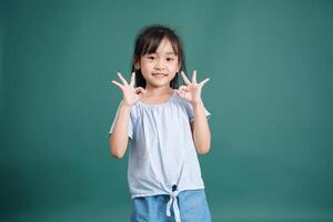 Photo of Asian baby girl on background