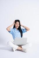 Photo of young Asian girl on white background