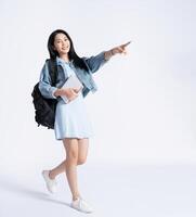 Photo of young Asian girl wearing dress on background