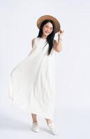 Photo of young Asian girl wearing dress on background