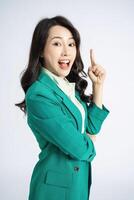 Image of young Asian business woman on background photo