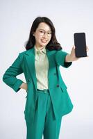 Image of young Asian business woman on background photo