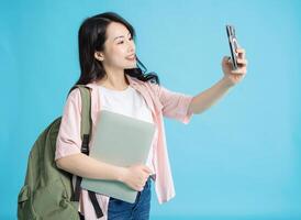 Photo of young Asian woman on background