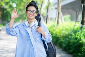 Portrait of young Asian man outside photo