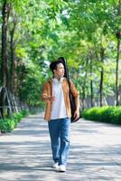 Portrait of young Asian man outside photo