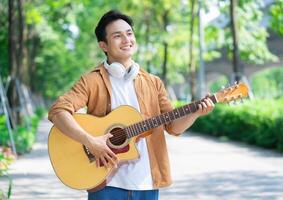 Portrait of young Asian man outside photo