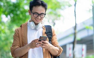 Portrait of young Asian man outside photo