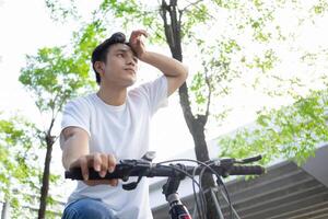 Portrait of young Asian man outside photo