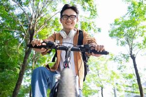 Portrait of young Asian man outside photo