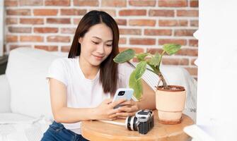 Photo of young Asian woman at home