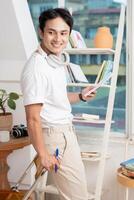 Photo of young Asian man at home