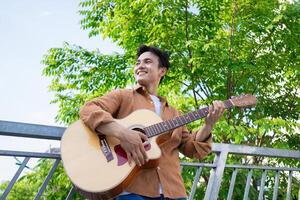 Portrait of young Asian man outside photo