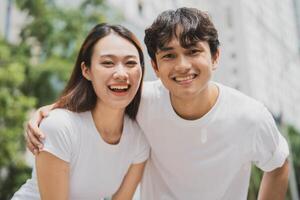 Photo of young Asian couple outdoor