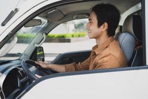 Photo of young Asian man with his truck