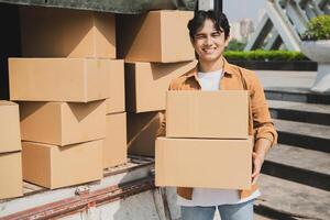 Photo of young Asian deliveryman working