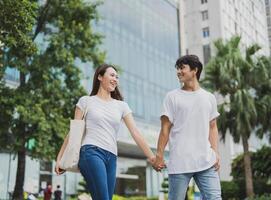 Photo of young Asian couple outdoor