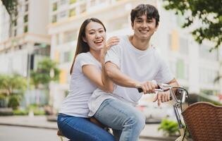 Photo of young Asian couple outdoor