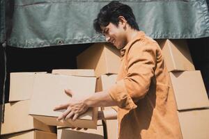 Photo of young Asian deliveryman working