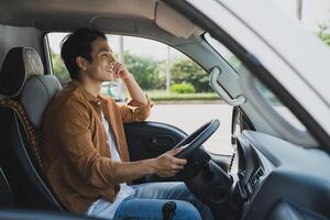 Photo of young Asian man with his truck