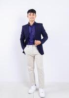 Photo of young Asian businessman on white background