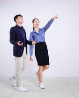 Photo of two young Asian business people on white background