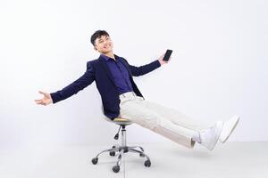 Photo of young Asian businessman on white background