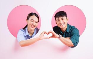 Photo of young Asian couple on background