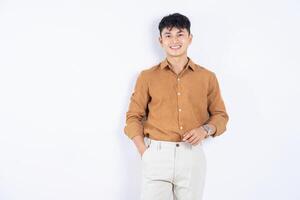 Photo of young Asian businessman on white background