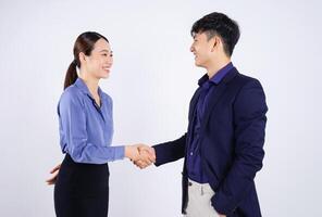 Photo of two young Asian business people on white background