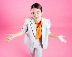 Photo of young Asian businesswoman on background