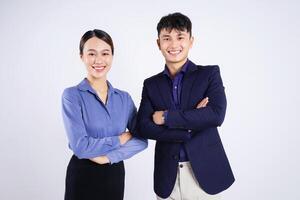 Photo of two young Asian business people on white background