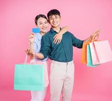 Photo of young Asian couple on background