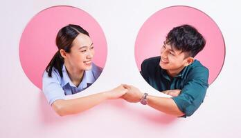 Photo of young Asian couple on background