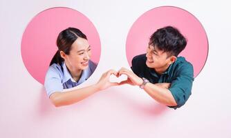 Photo of young Asian couple on background