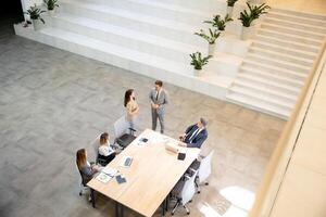 Aerial view at young startup team working in the office photo