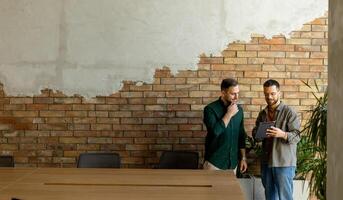 Collaborative Discussion in a Modern Office With Exposed Brick Walls photo