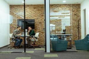 Casual Business Meeting in a Modern Office Lounge photo