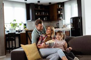 Family Movie Night, Engrossed in Thrilling Scenes at Home photo