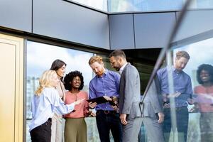 Business Professionals Engaging in a Strategy Discussion Outside a Modern Office Building photo