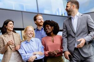 Casual Networking Event at Office, Professionals Mingling in Modern Glass Building. photo