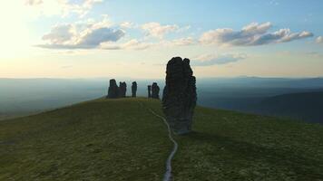 Aerial view on the weathered stone pillars on the plateau. Tourist attraction video