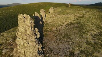 Aerial. Weathered stone pillars on the Manpupuner plateau. Tourist attraction video