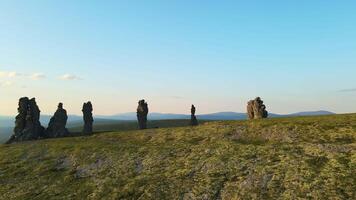 Aerial. Weathered stone pillars on the Manpupuner plateau. Tourist attraction video