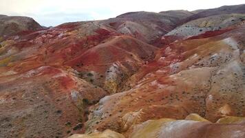 The red mountains look like a Martian landscape. Aerial video