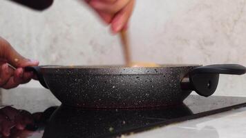 cooking pan on electric stove, electric stove is heated to red. video