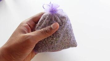 hand holding a purple lavender bag video